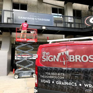 sign installation at athletic facility